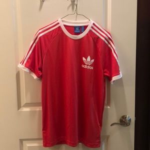 Coral Adidas soccer shirt.
